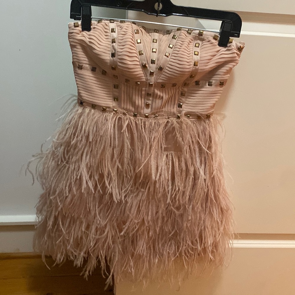 Strapless studded feather dress.